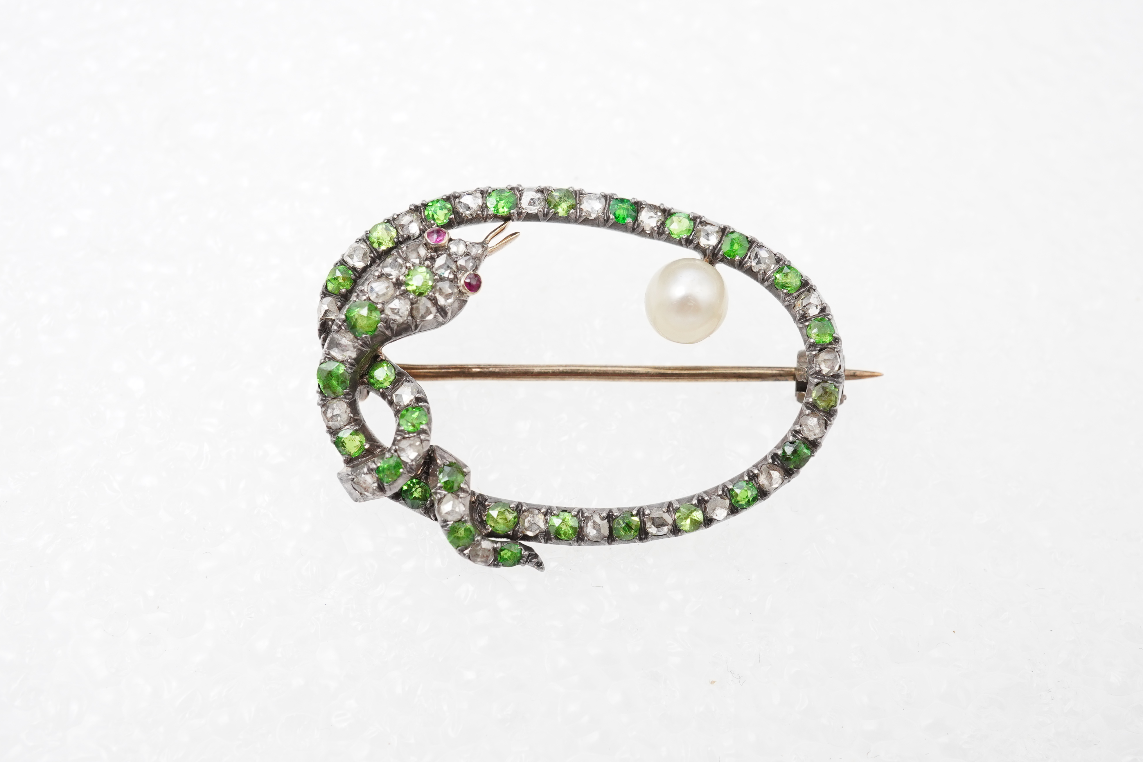 A Victorian demantoid garnet, pearl and diamond brooch, late 19th century